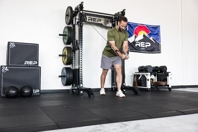 power rack with front foot extension pair 2.0 adding stability to front of rack while someone use cable machine attachment for flys
