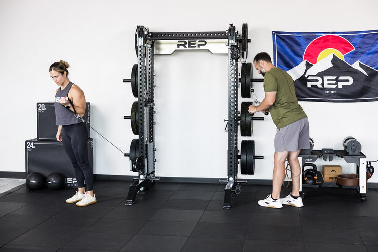 power rack with front foot extension pair 2.0 adding stability to front of rack while people are using the cable machine attachment