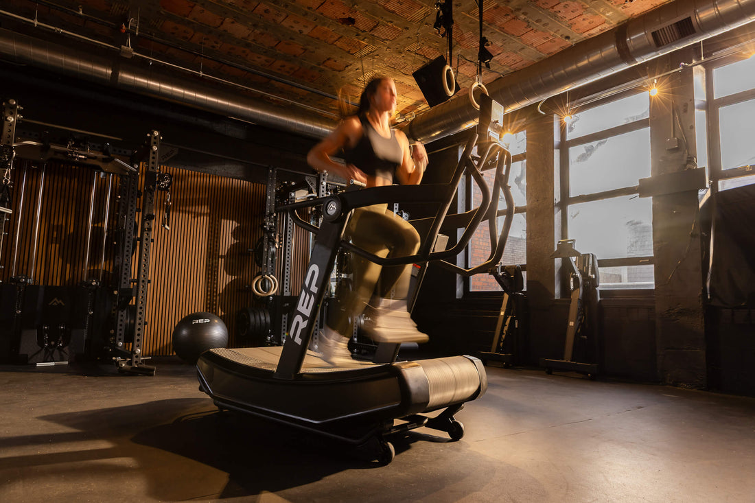 Athlete runs on the Strive™ Curved Treadmill.
