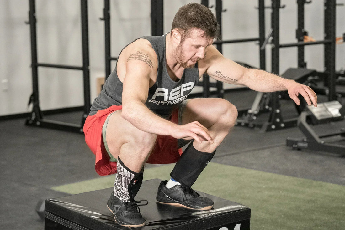 Athlete does a box jump on a REP® Plyo Box.