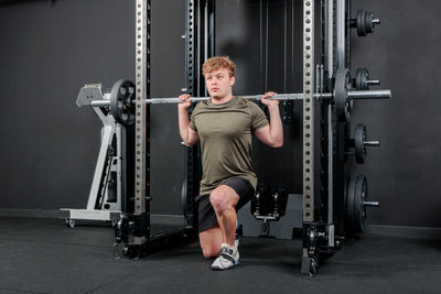 Athlete using the REP Fitness Altitude™ Power Rack Smith Machine Attachment for lunges